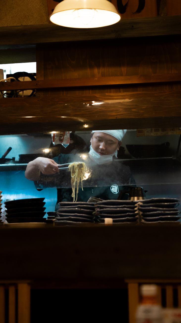 Culinary masters preparing ramen